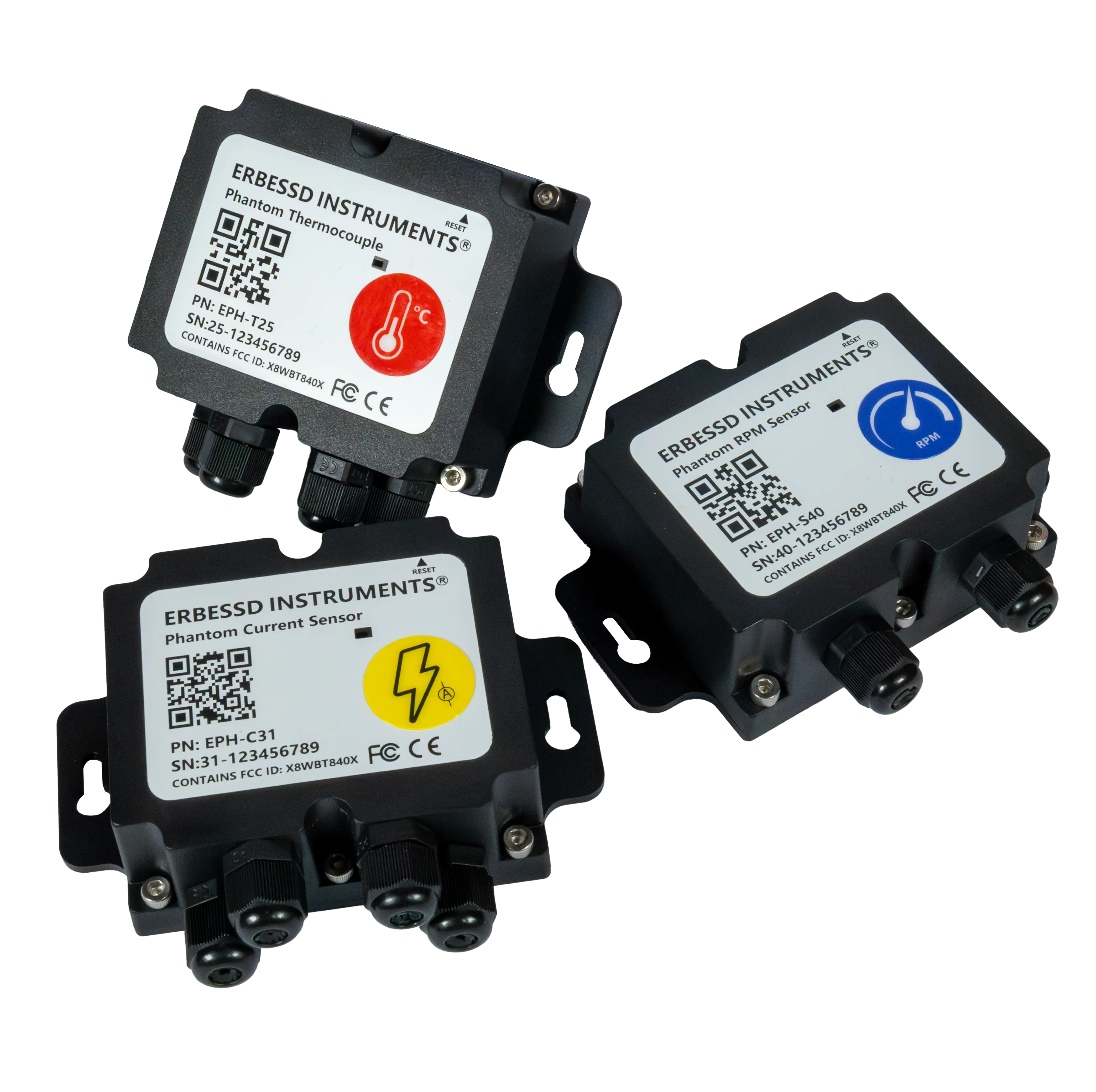 Tres sensores inalámbricos PHANTOM® en sus cajas negras: termopar, corriente y velocidad
