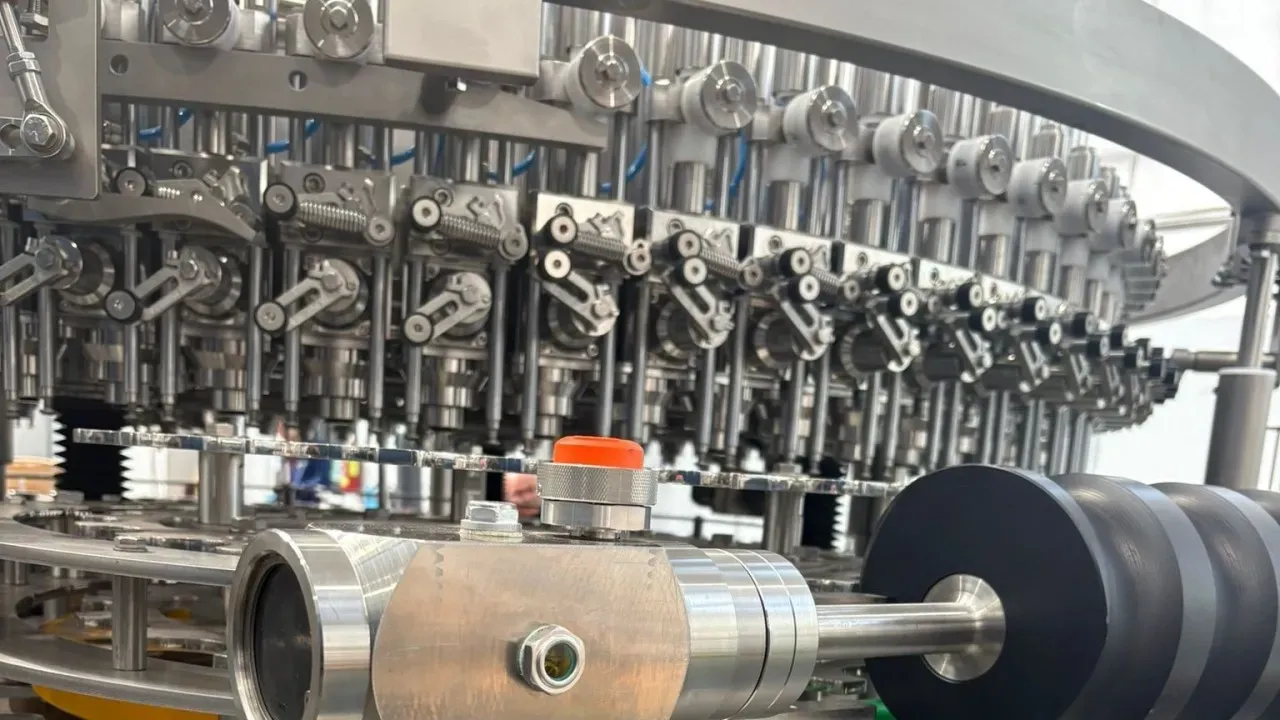 Filling machine carousel with the wireless triaxial accelerometer installed in the foreground